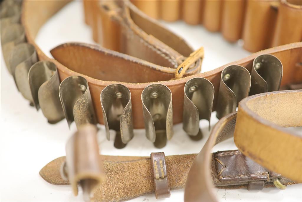 An Edwardian leather cartridge magazine and belts, case 36.5cm wide, 29cm deep